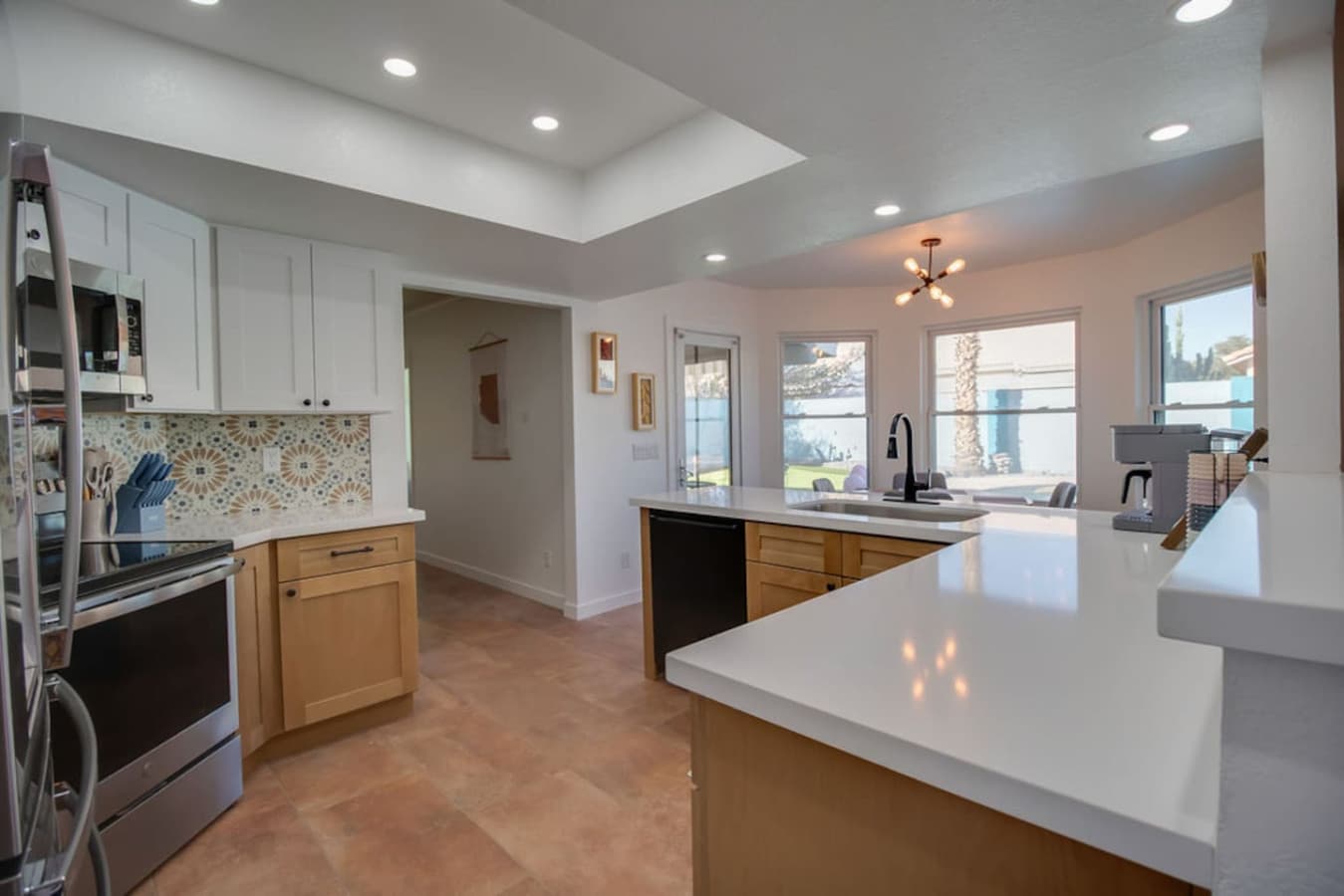 Open kitchen with modern finishes and plenty of prep space.