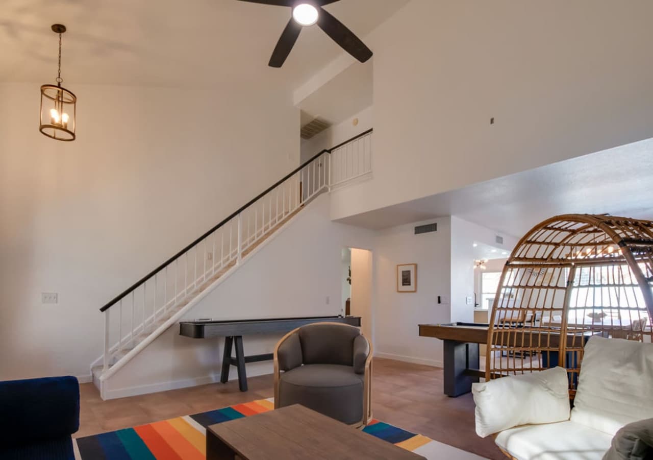 Open concept living area with high ceilings and plenty of seating.