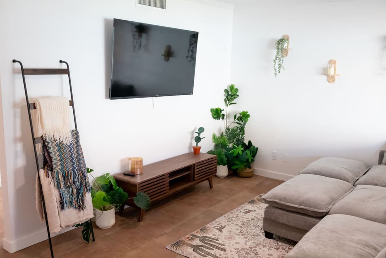 Entertainment wall with smart TV and curated decor.
