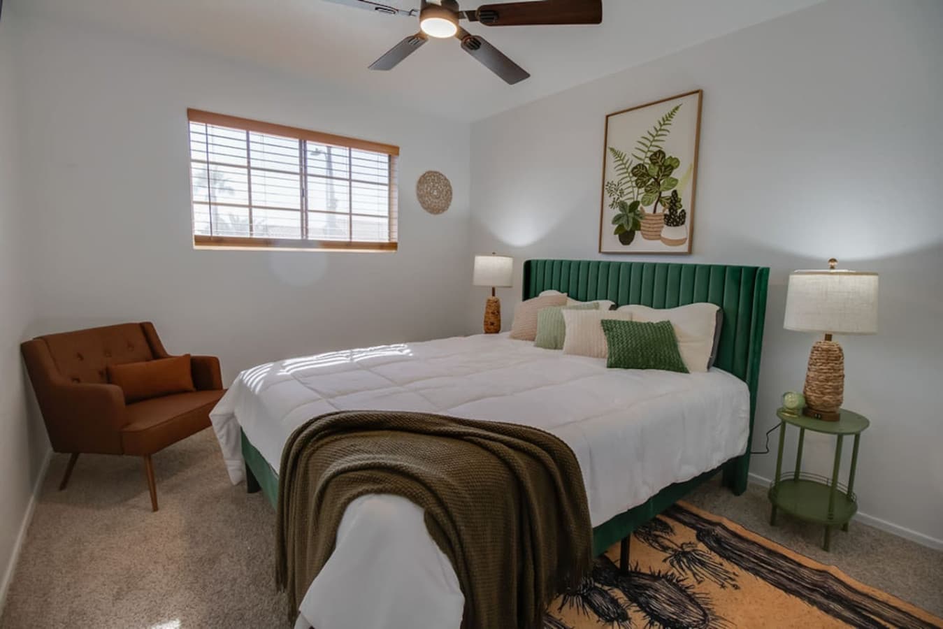 Serene bedroom with calming tones and comfortable queen bed.