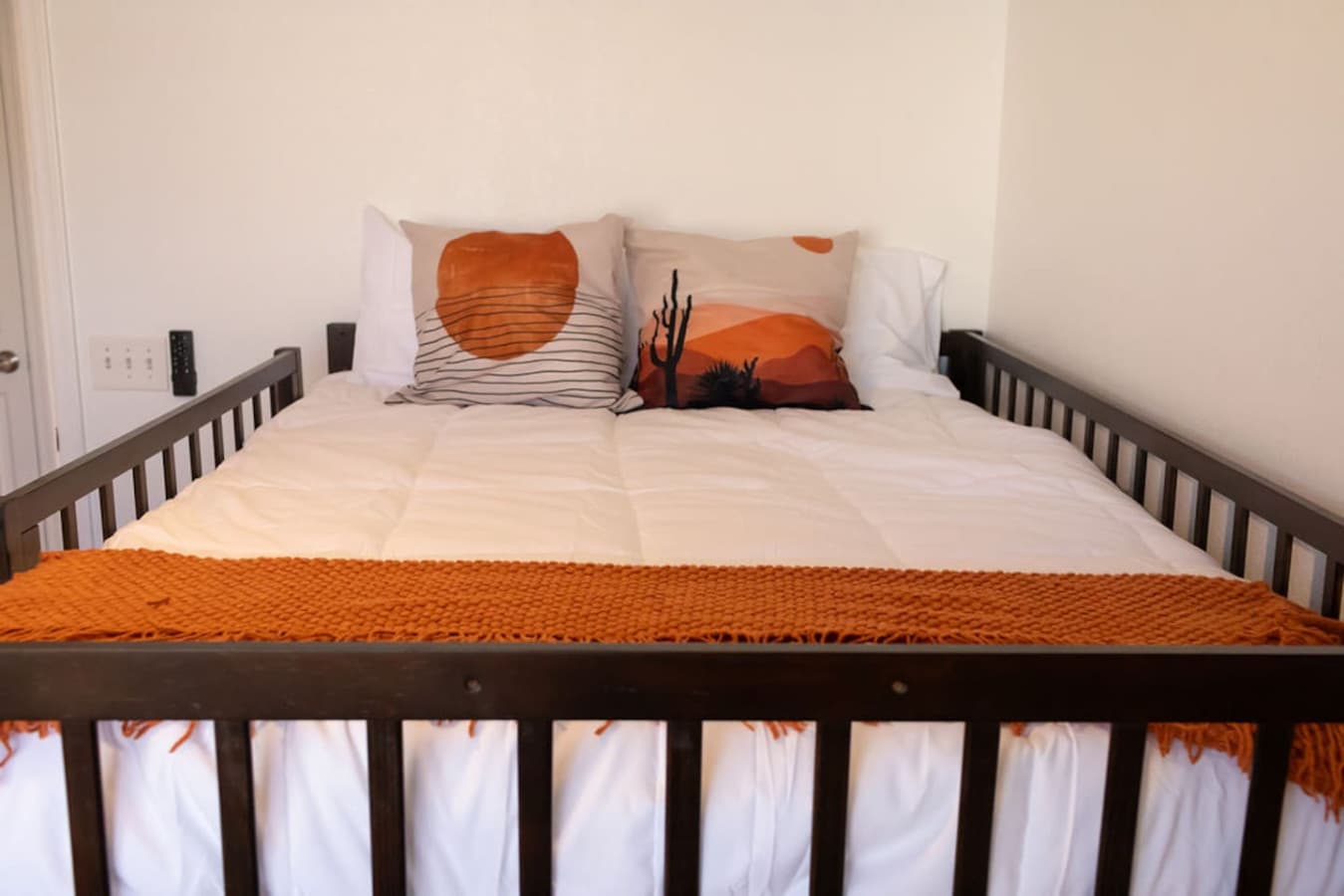 Lower bunk bed with warm tones and comfortable linens.