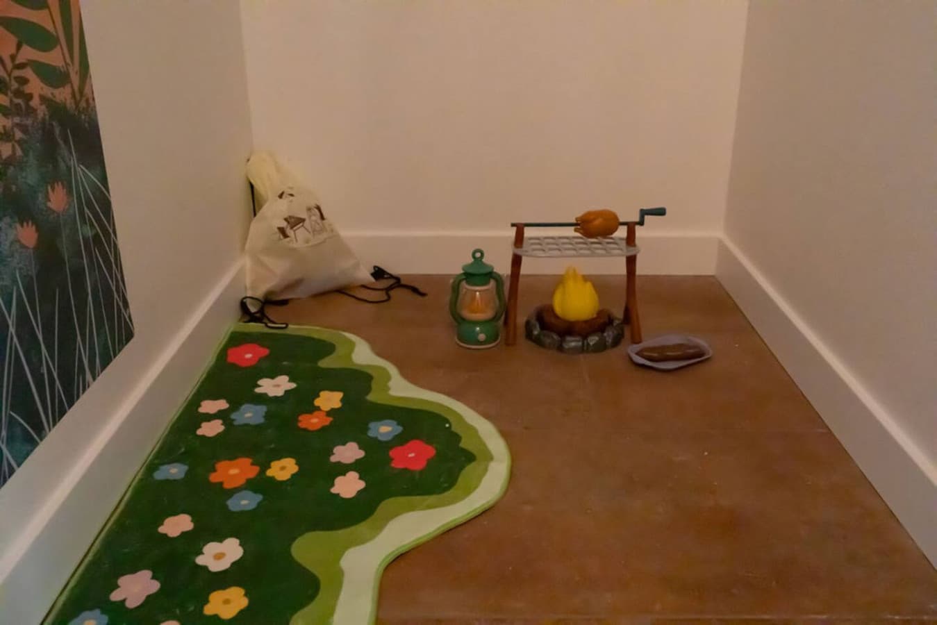 Dedicated play area with toys and soft floor mat.