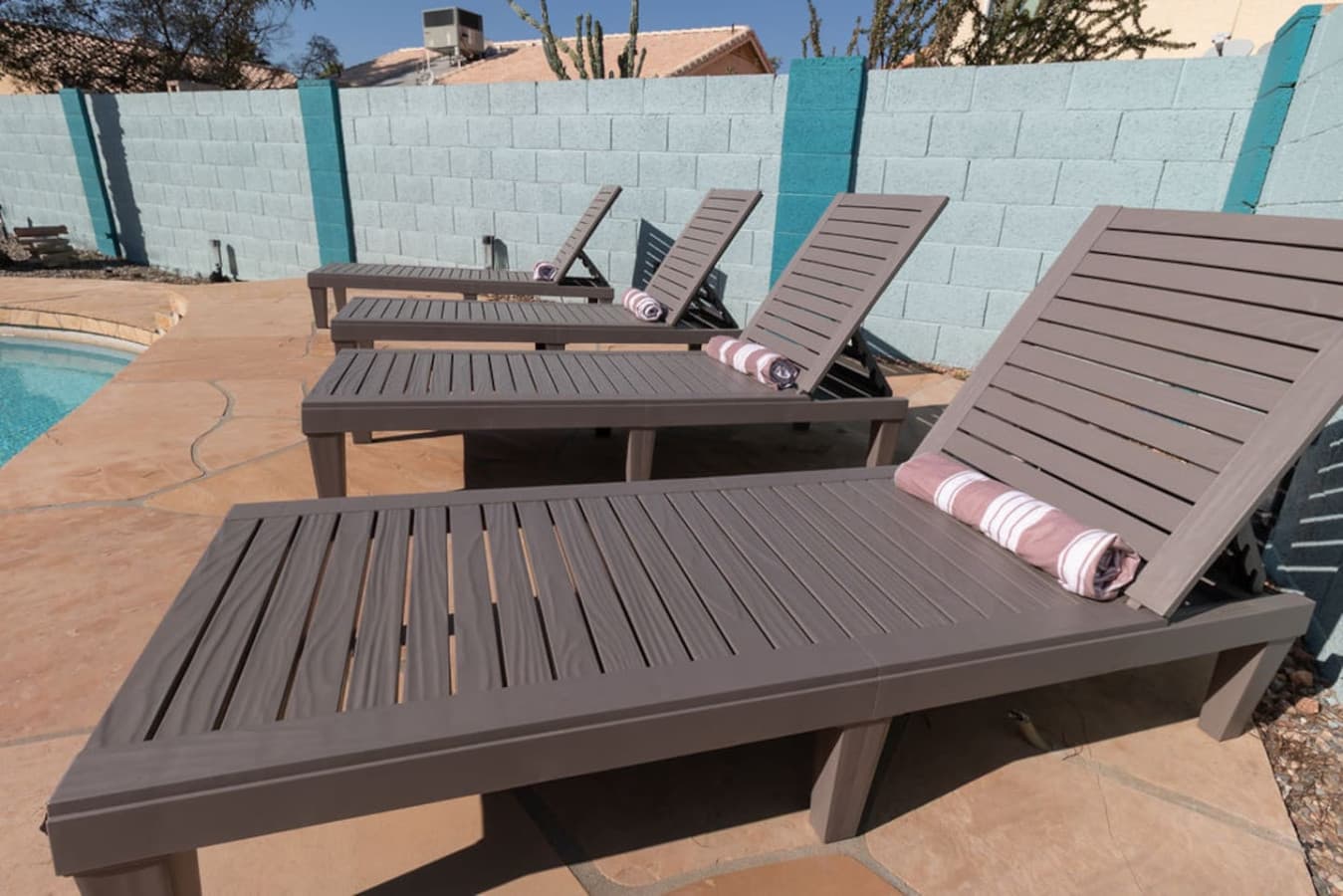 Poolside loungers perfect for relaxing in the sun.