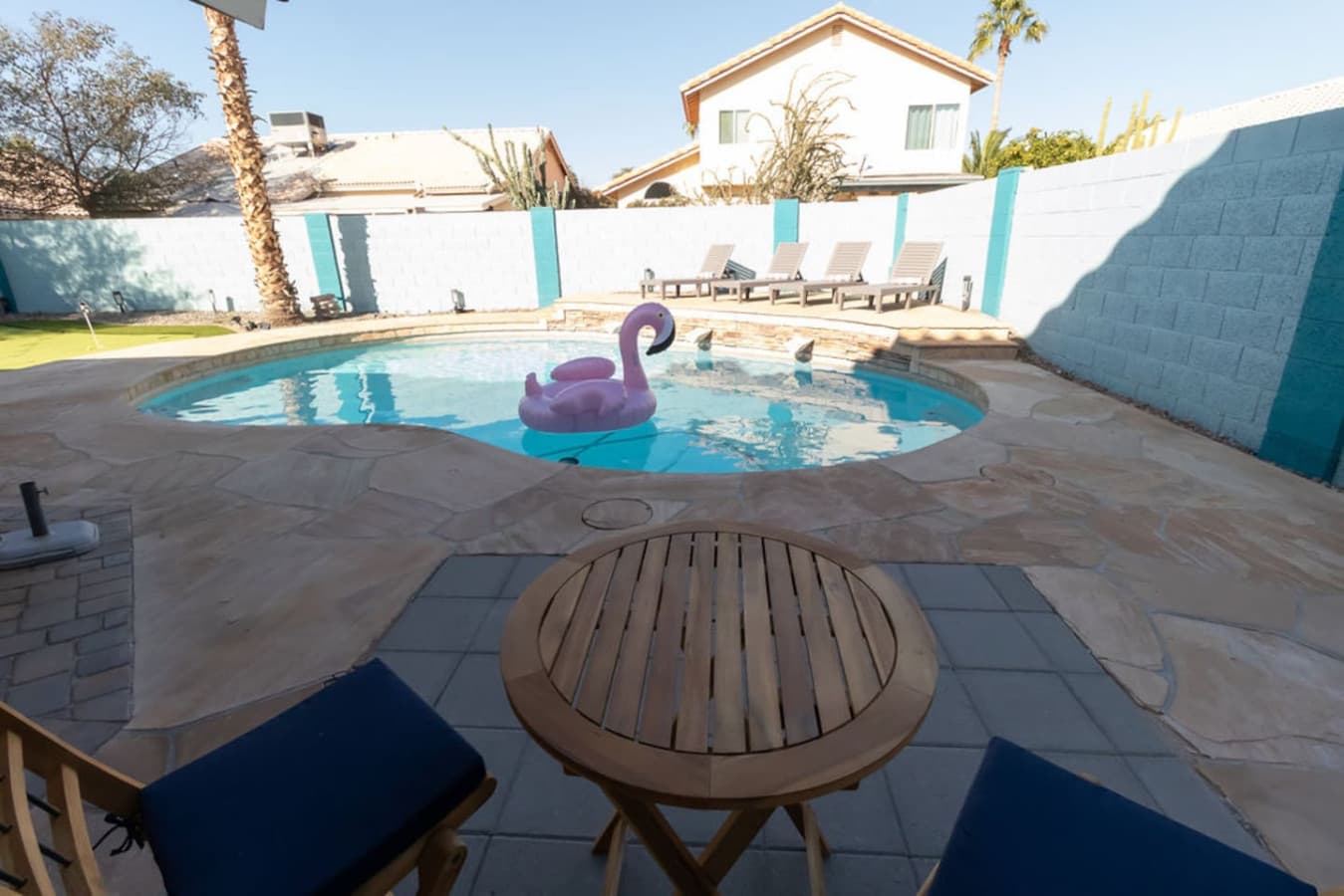 Outdoor pool area with seating and space to unwind.