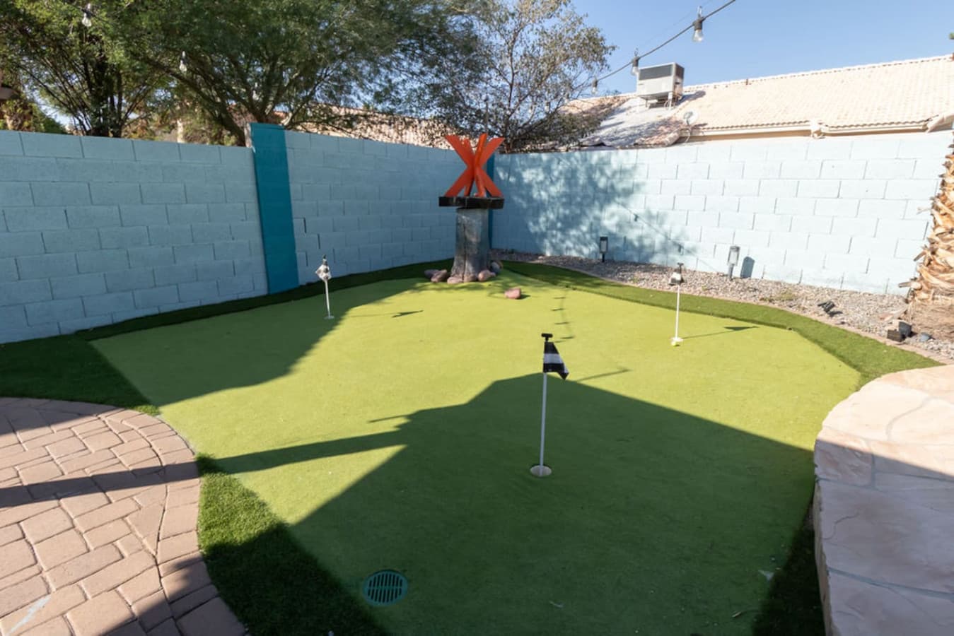 Private turf green perfect for relaxed outdoor fun.