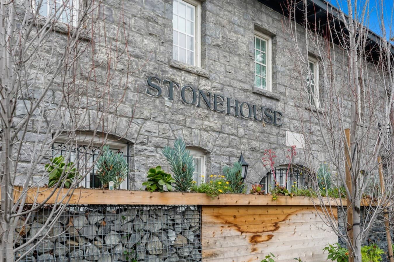 A charming stone exterior with rustic character offering a warm and inviting first impression of this beautifully preserved historic property.