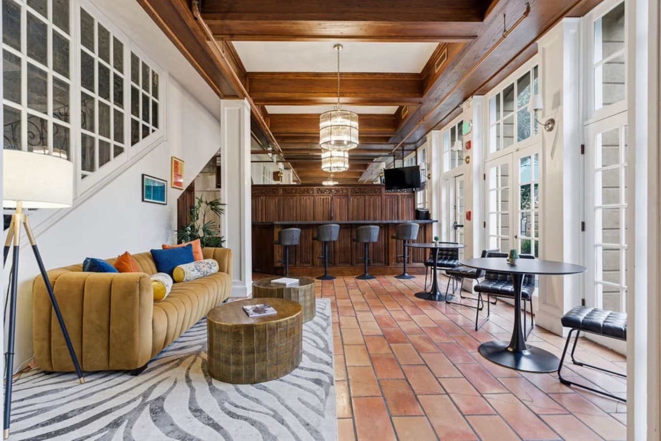 A spacious and beautifully designed shared common area with upscale finishes offering an inviting setting for dining or unwinding.