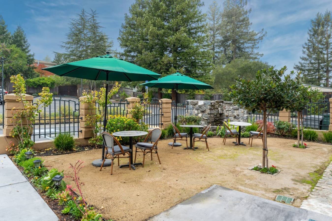 A charming shared outdoor patio with shaded seating offering a relaxing spot to enjoy the fresh air.