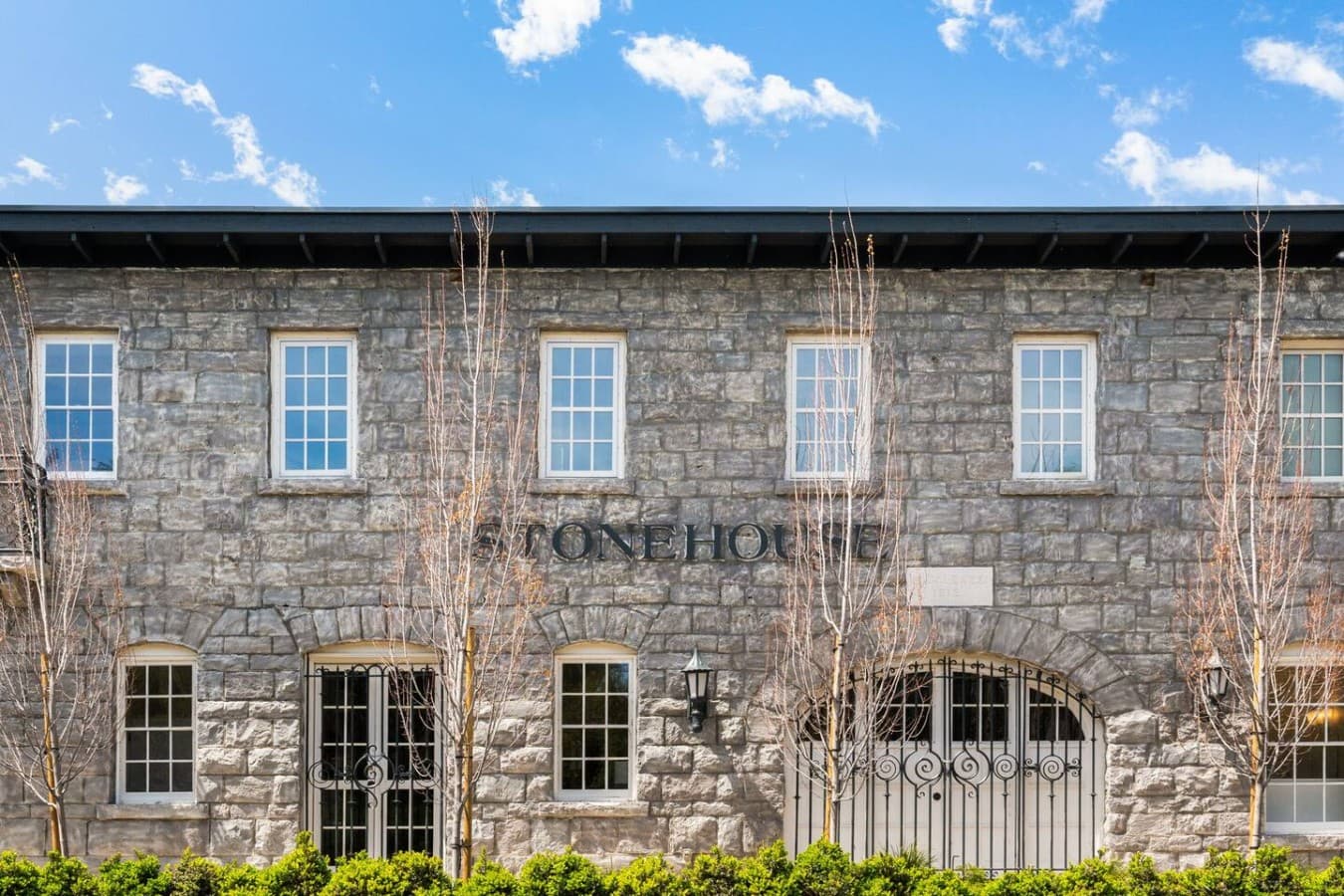 A close look at the hotel’s stone facade and entry details capturing its unique historic charm.
