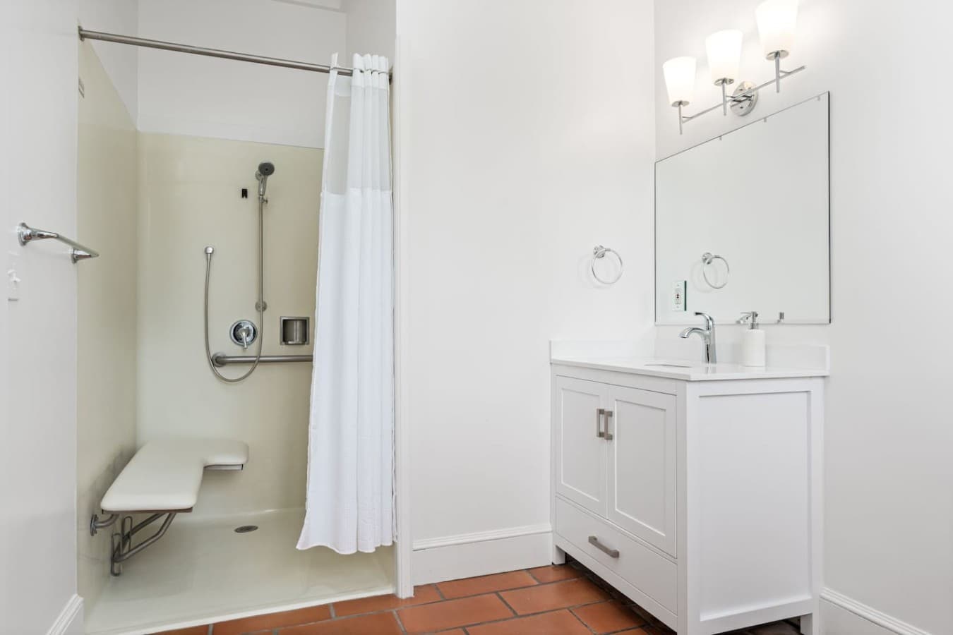 This is the private bathroom inside the room you will be renting featuring a walk-in shower and accessible design.