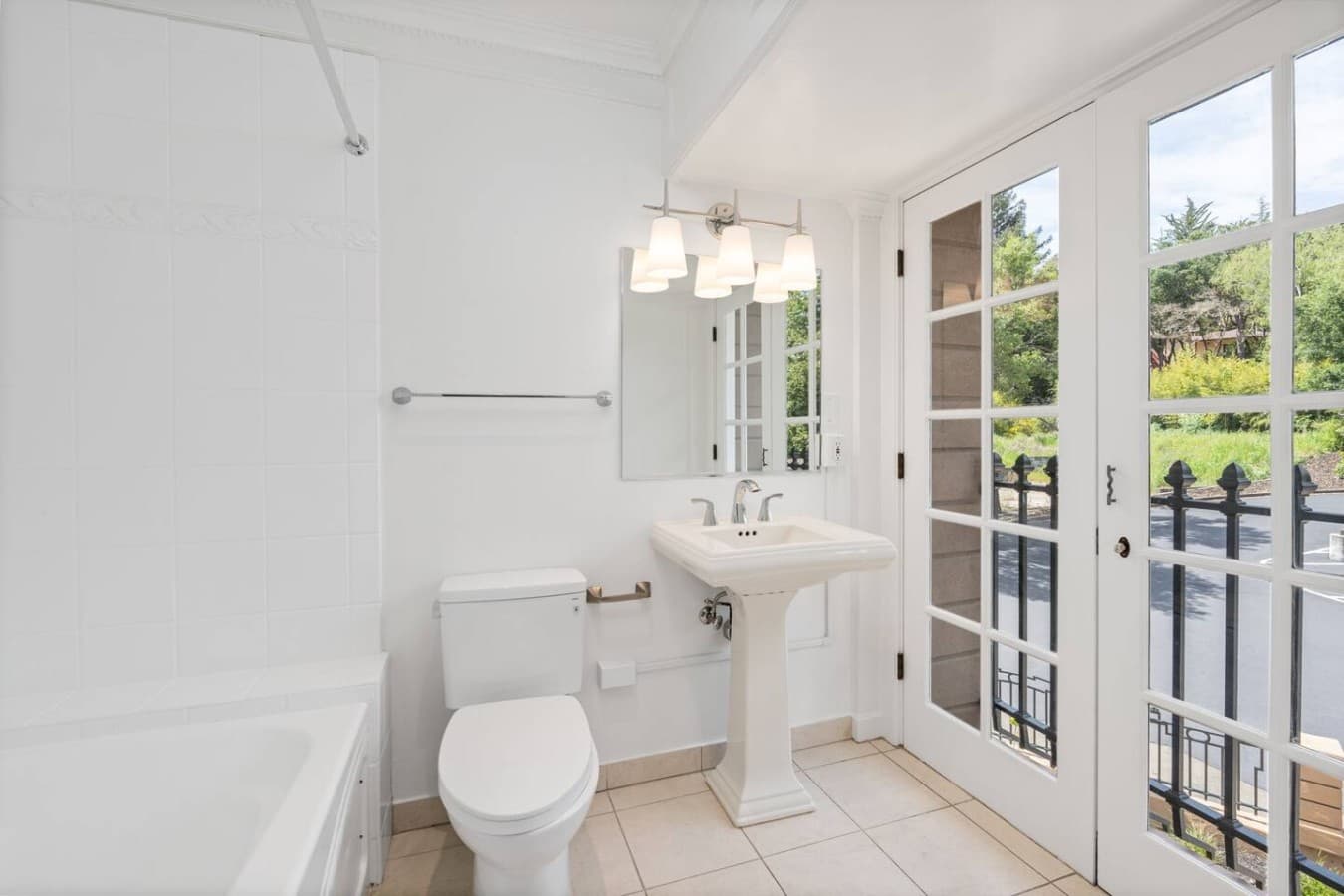Crisp white design with spacious shower and elegant finishes.