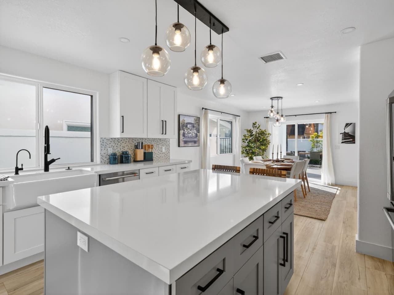 Bright chef’s kitchen with quartz countertops and stainless appliances.