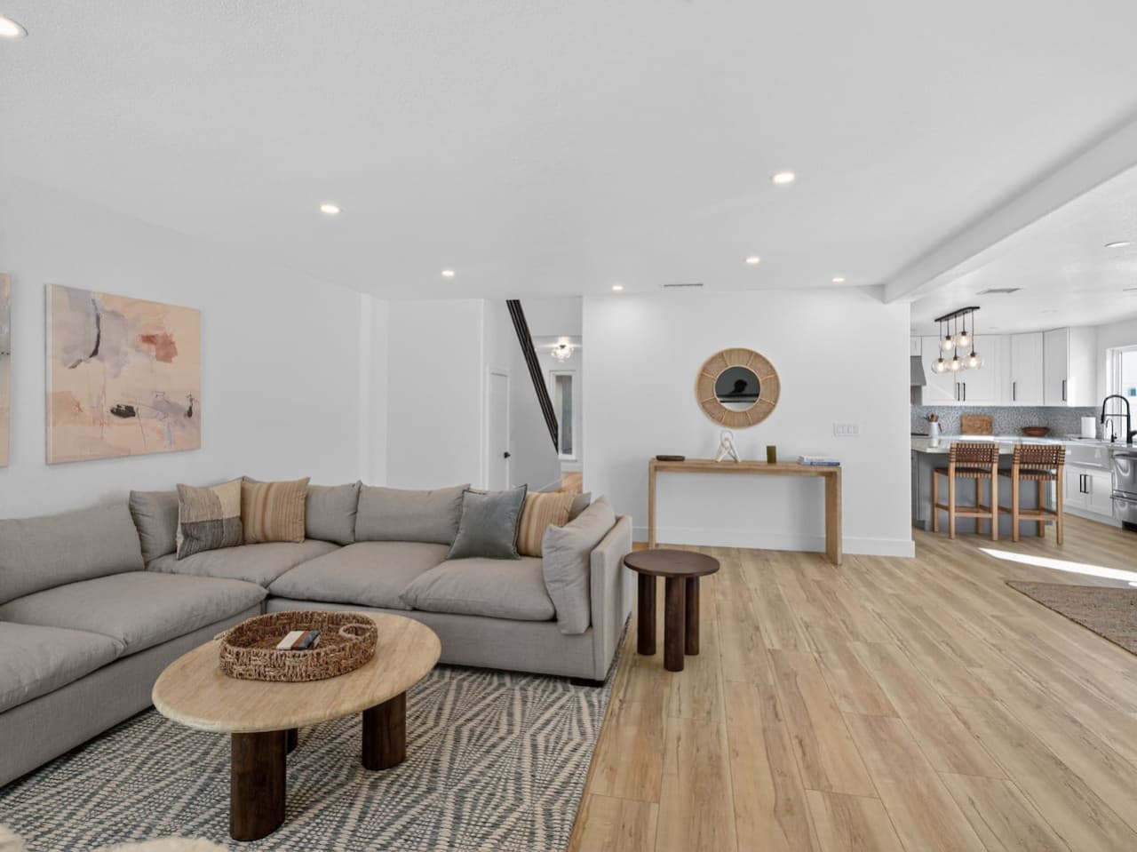 Spacious living area with open layout and modern coastal design.