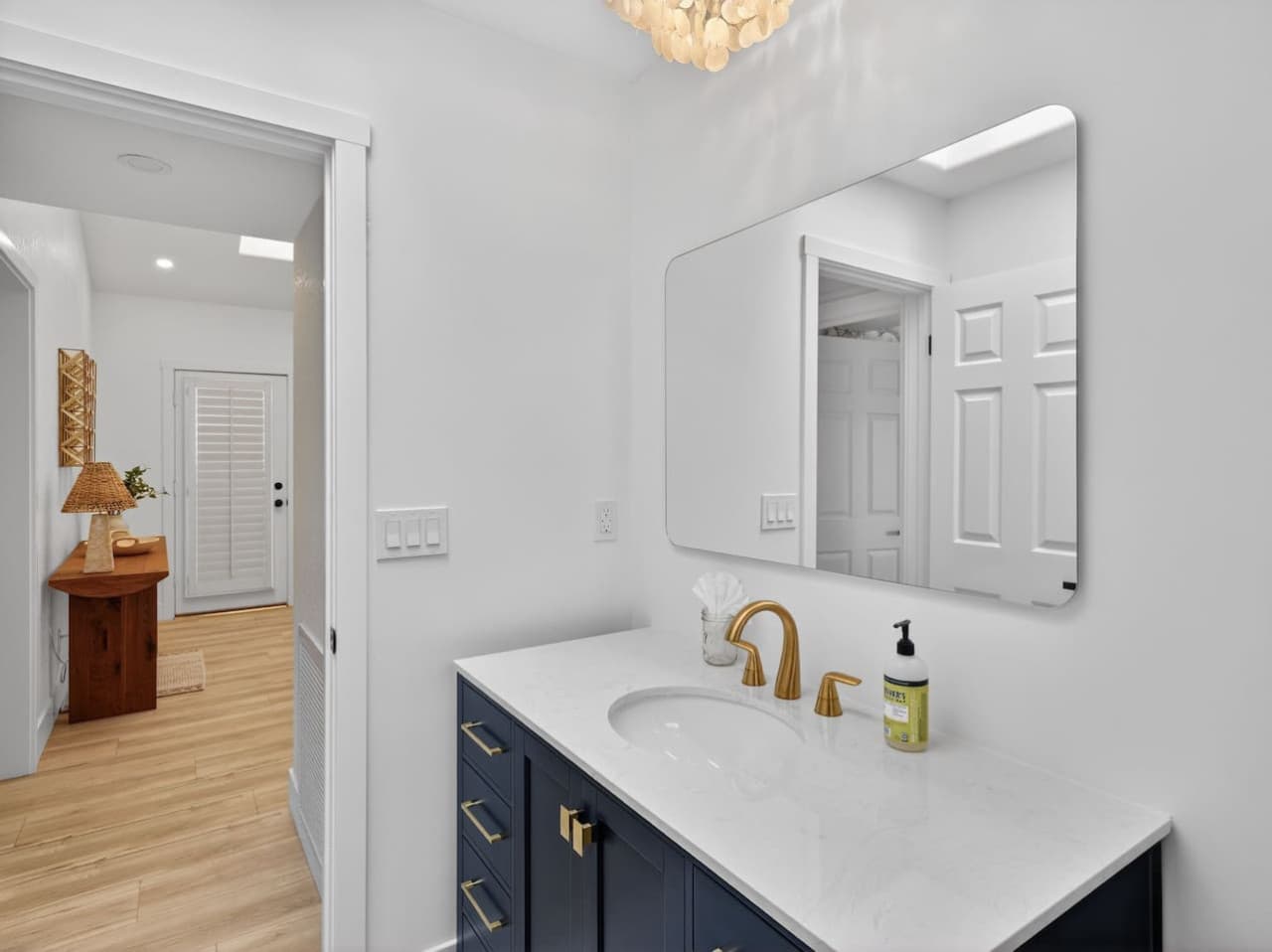 Clean and bright bathroom with modern finishes and storage.
