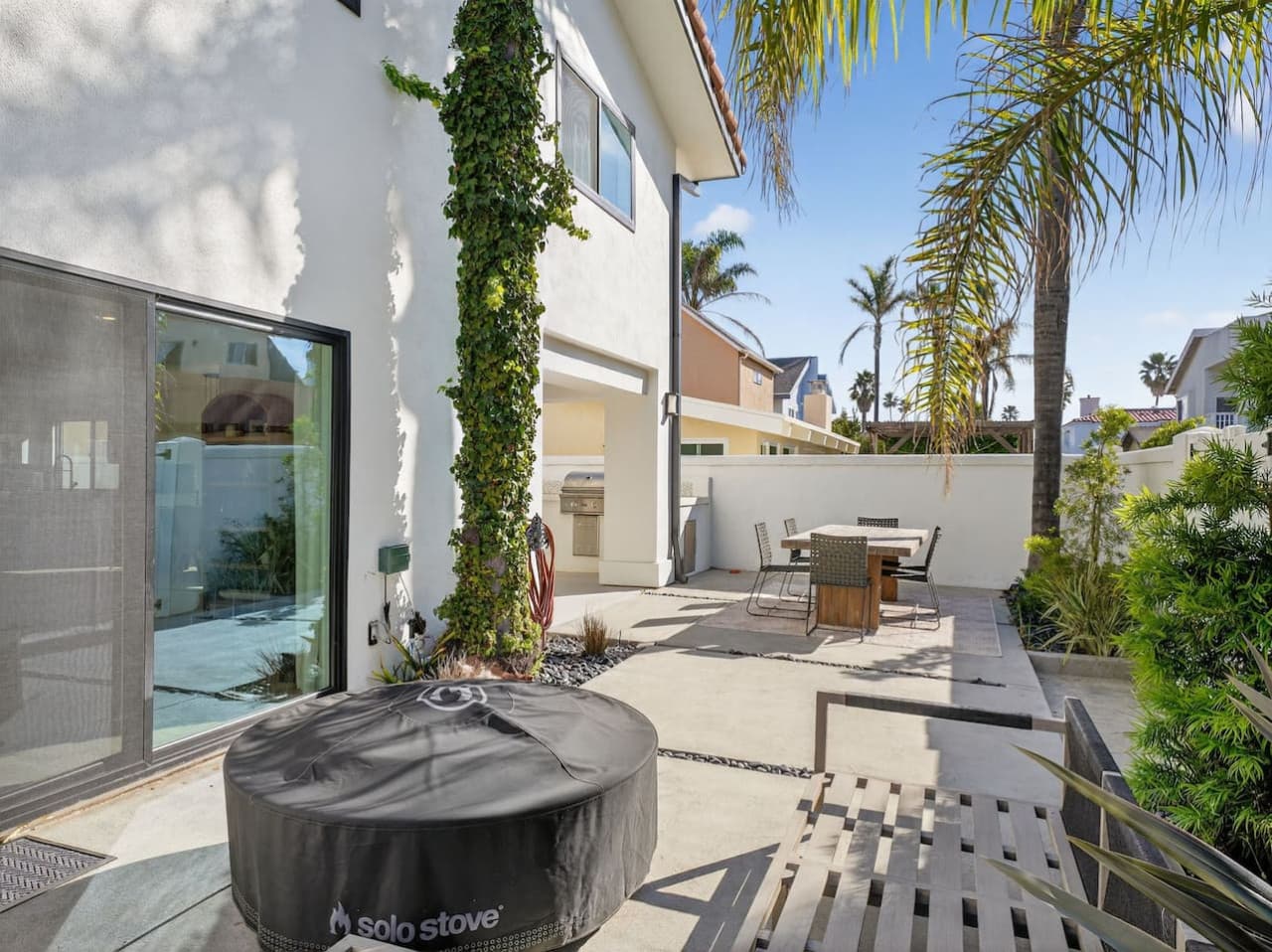 Private outdoor patio with seating area and space to relax.