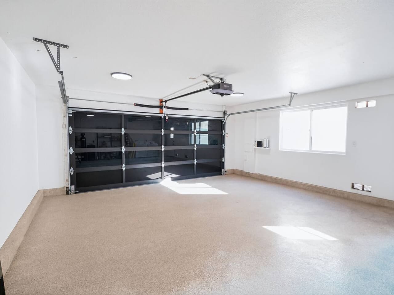Spacious garage with ample room for parking or storage.