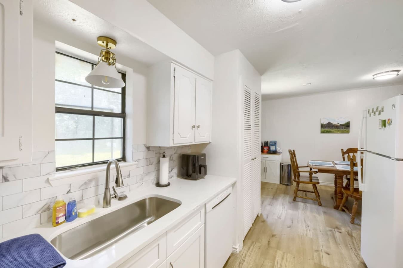 Fully stocked kitchen with modern touches and convenient prep space.