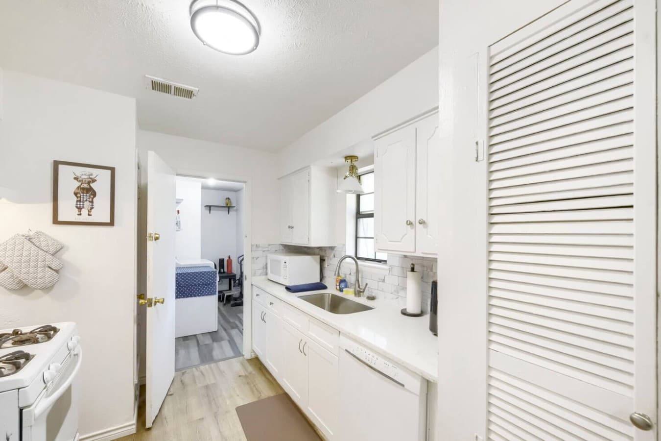 Bright kitchen with clean finishes and convenient layout for everyday cooking.