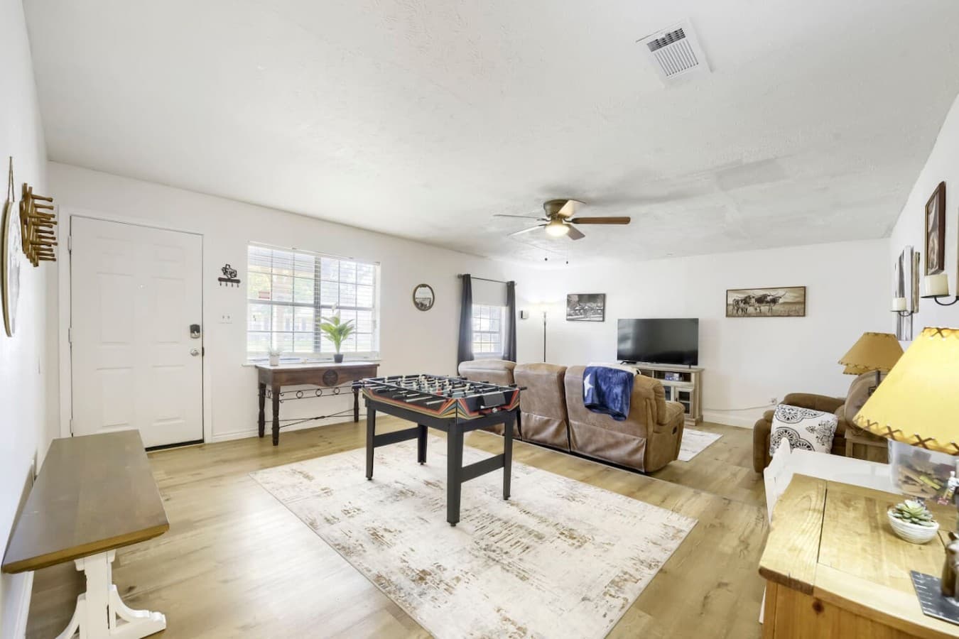 Inviting living room with foosball table and cozy space to relax after a long day.