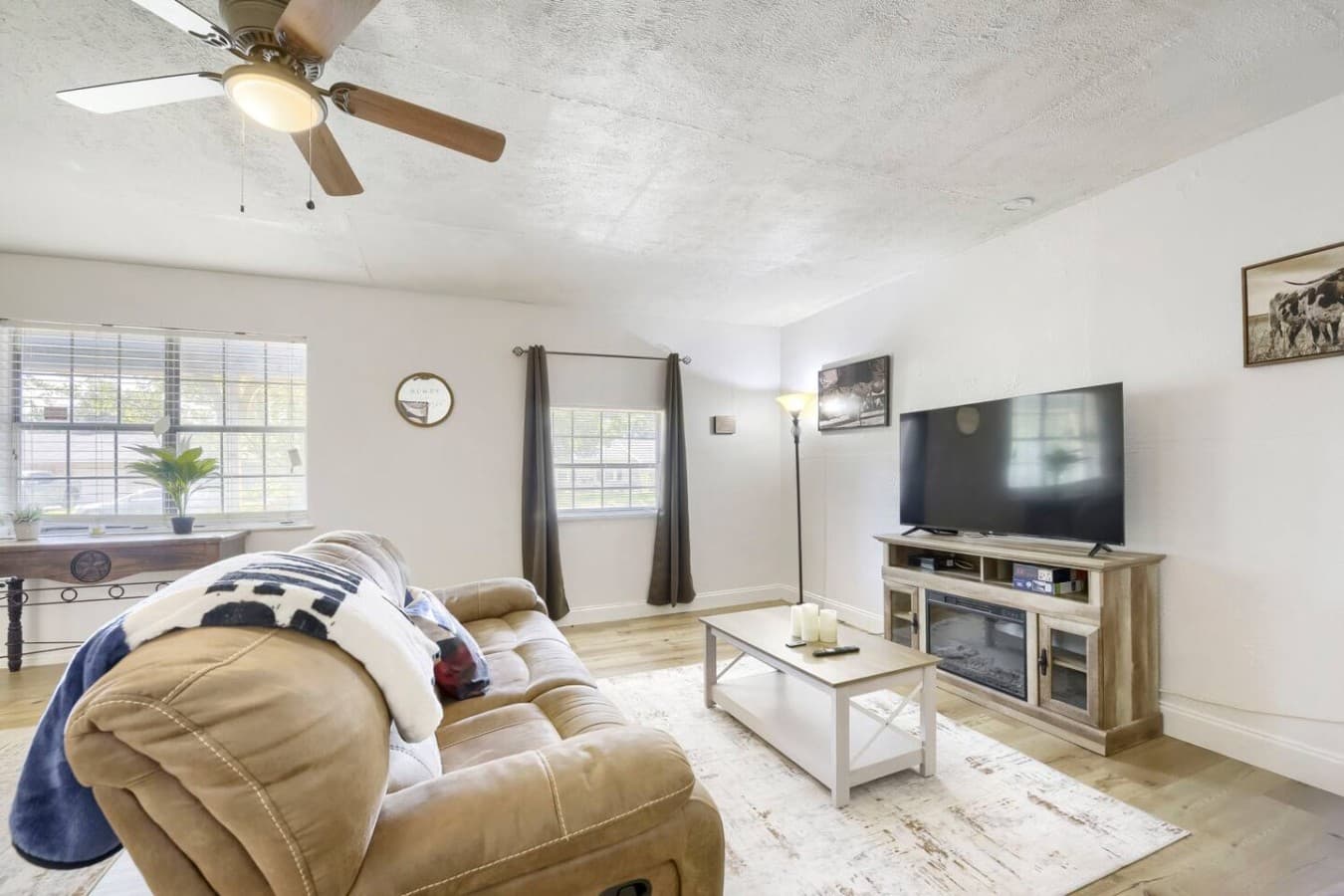 Cozy living room with oversized seating and large TV for movie nights in.