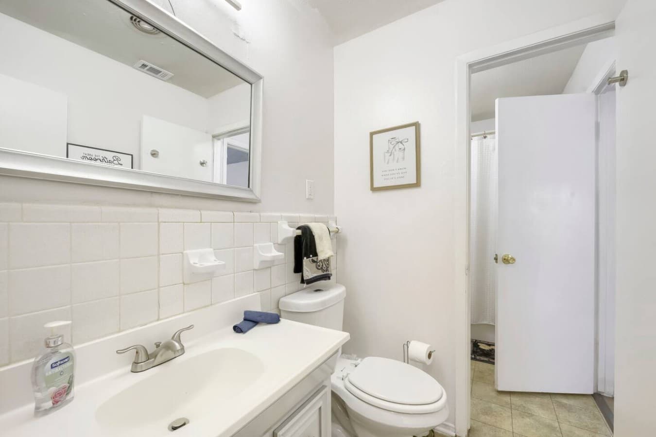 Clean and refreshed bathroom stocked with essentials for your stay.