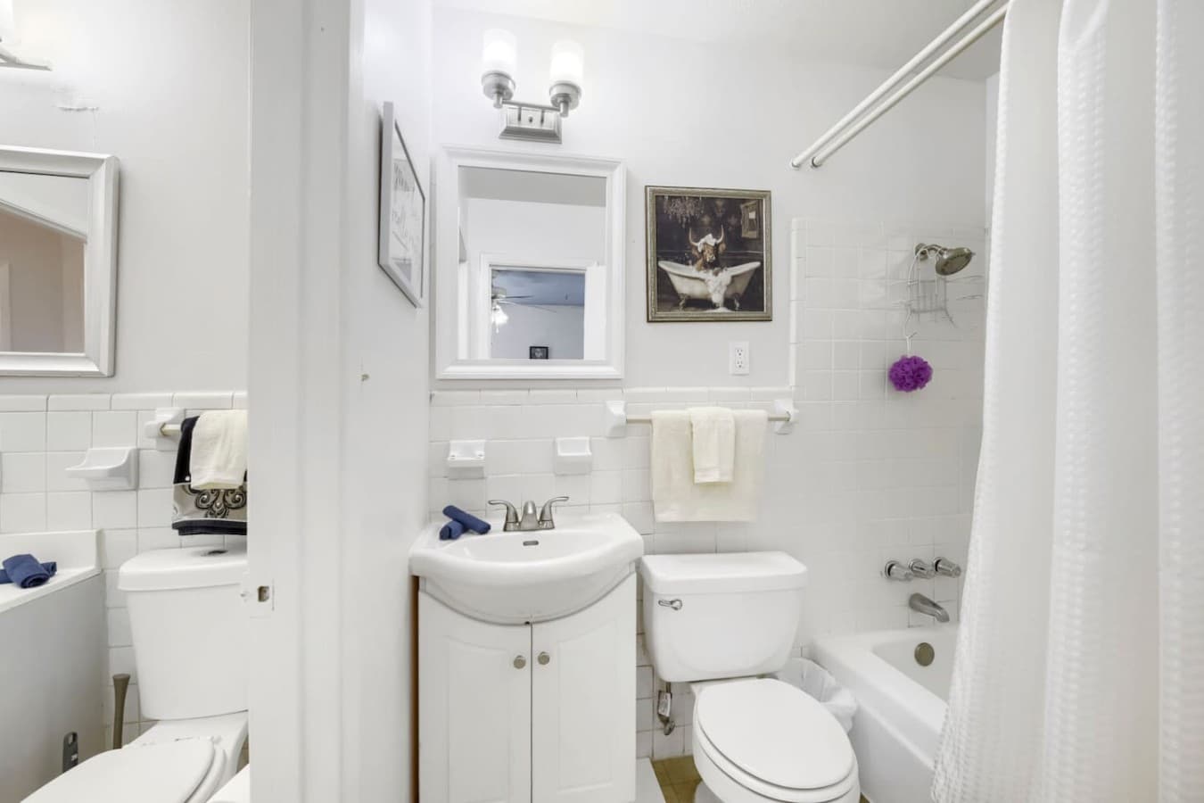 Full bathroom with fresh towels and convenient layout for guests.