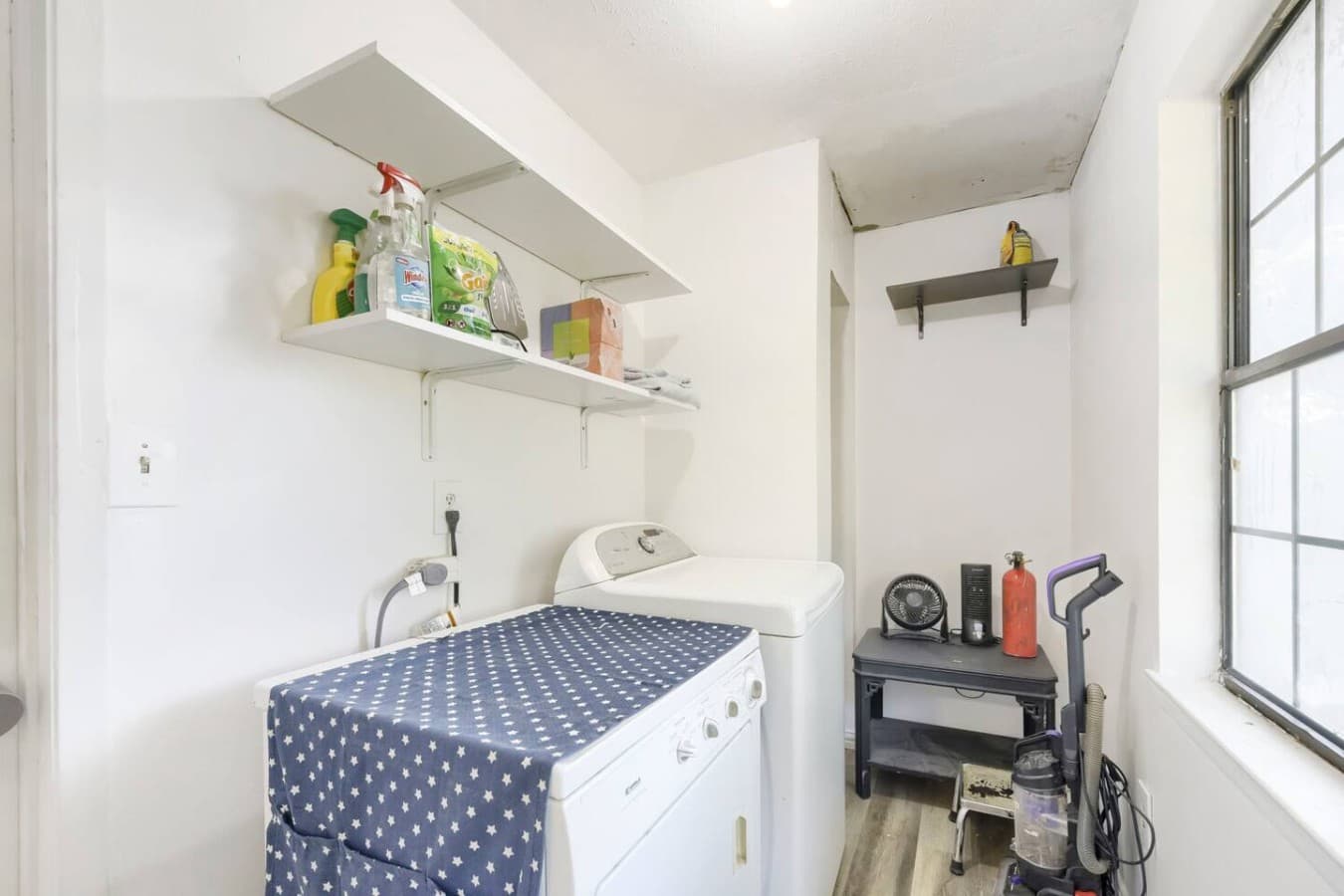 Dedicated laundry area with washer and essentials for longer stays.
