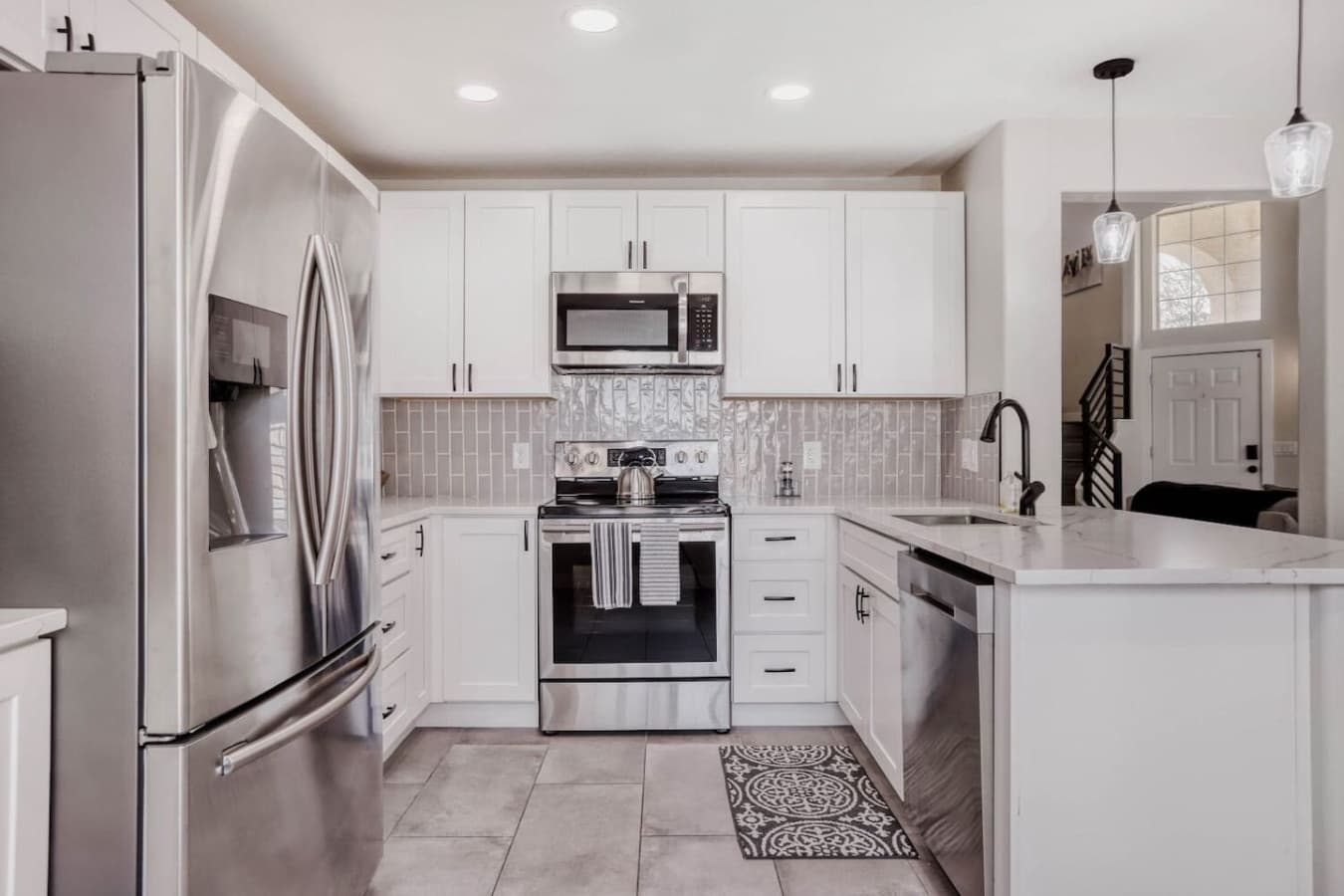 Stylish kitchen view featuring ample cabinetry and a clean modern layout.