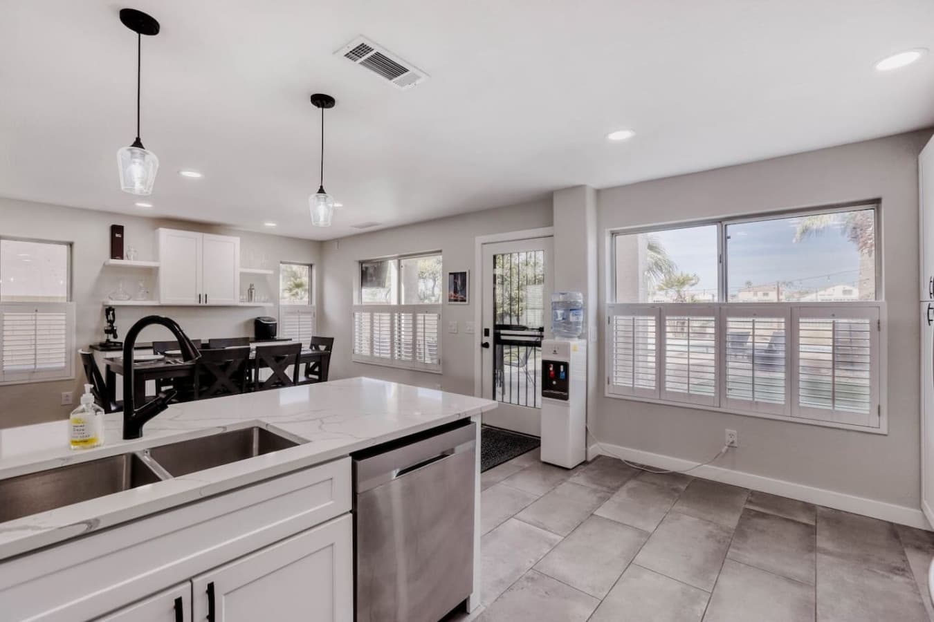 Open concept kitchen and dining area designed for gathering and easy entertaining.