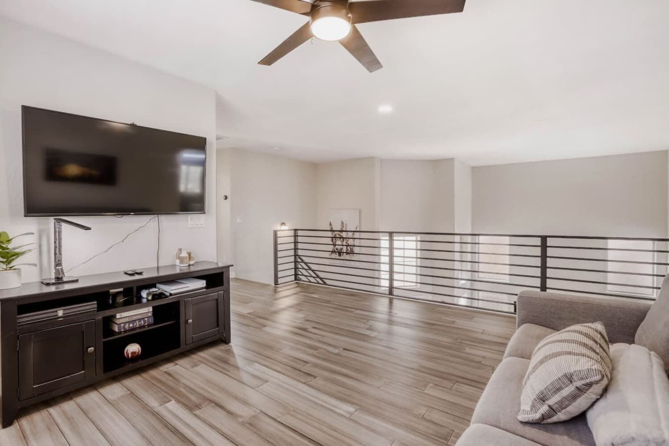 Upper level lounge space ideal for relaxing or movie nights.