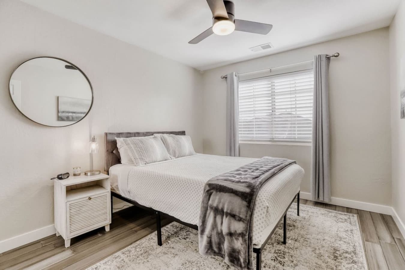 Light filled bedroom with soft textures and a peaceful atmosphere.