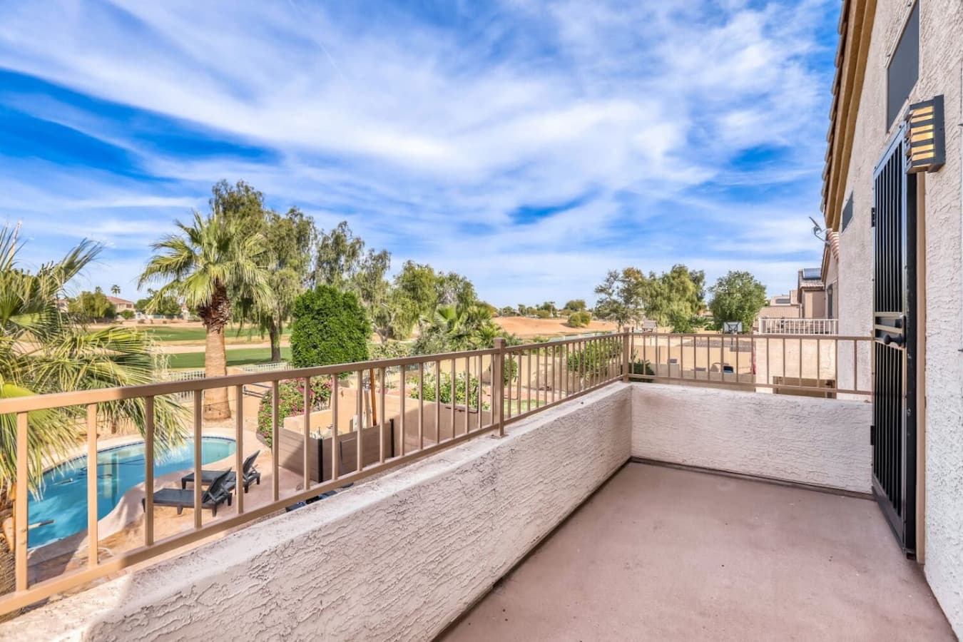 Spacious upper balcony offering fresh air and scenic neighborhood views.