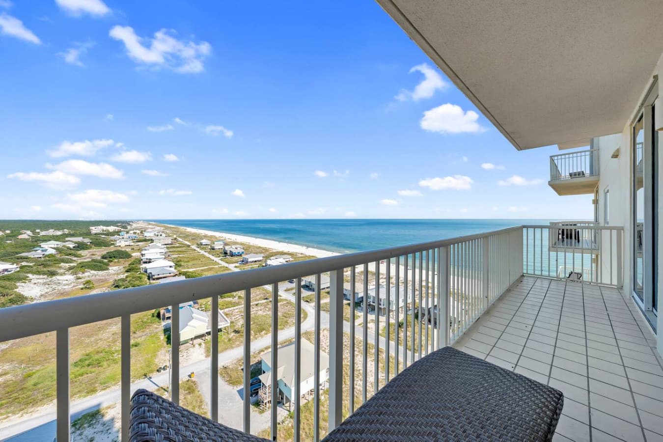 Spacious balcony offering panoramic views of the coastline.