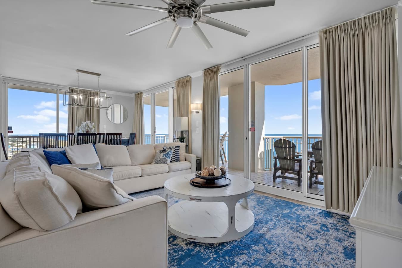 Sunlit space with ocean views, chic decor, and inviting seating for memorable gatherings!