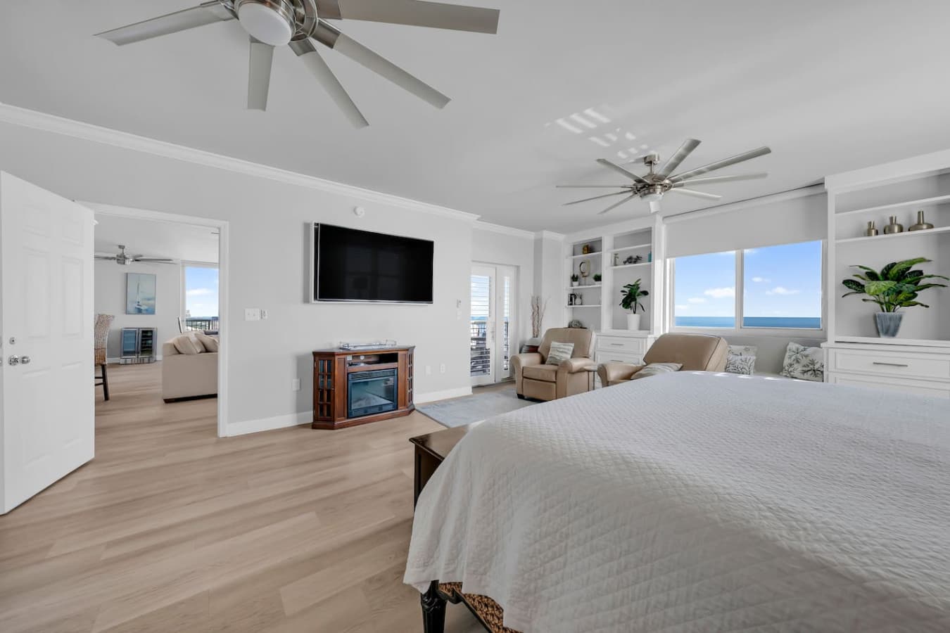 Relaxing bedroom retreat with ocean views and cozy seating.