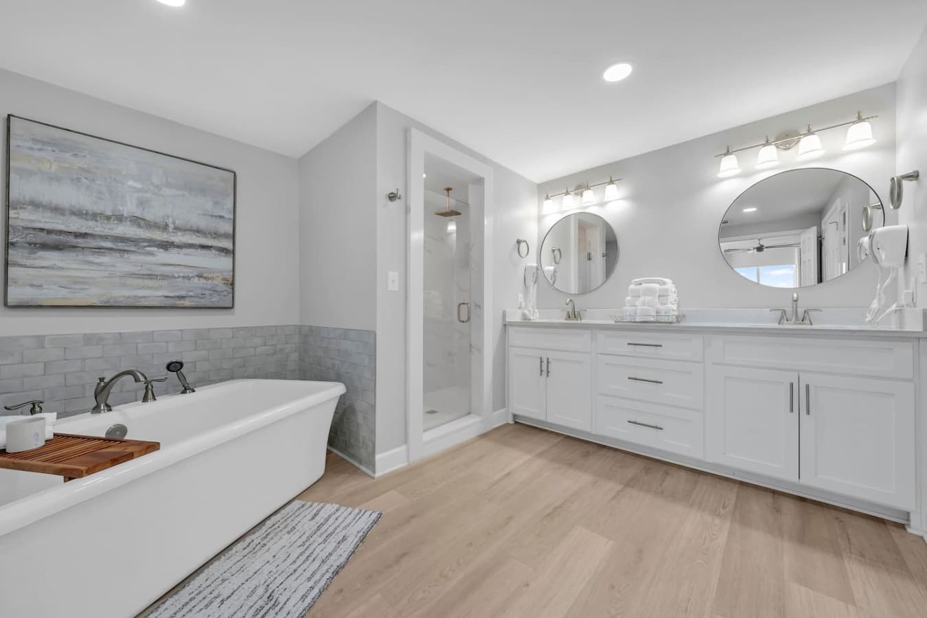 Spacious bathroom with double vanity and modern finishes.