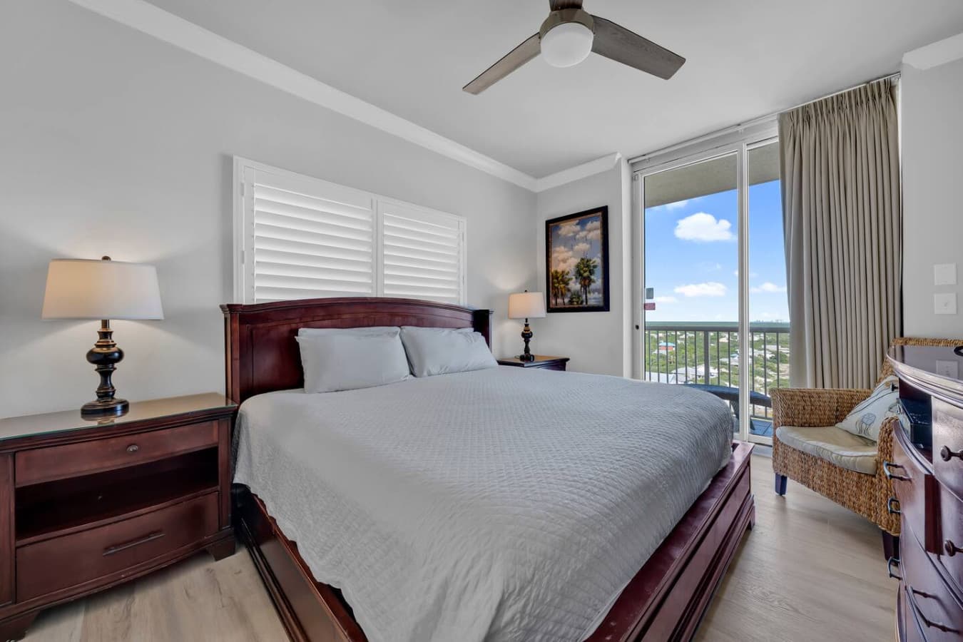 Comfortable bedroom with king bed and peaceful natural light.