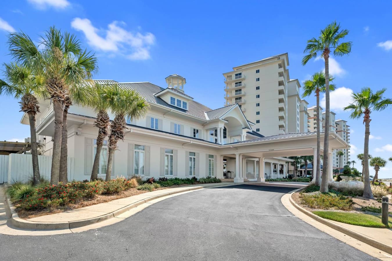 Welcoming resort style entrance with convenient covered drop off.