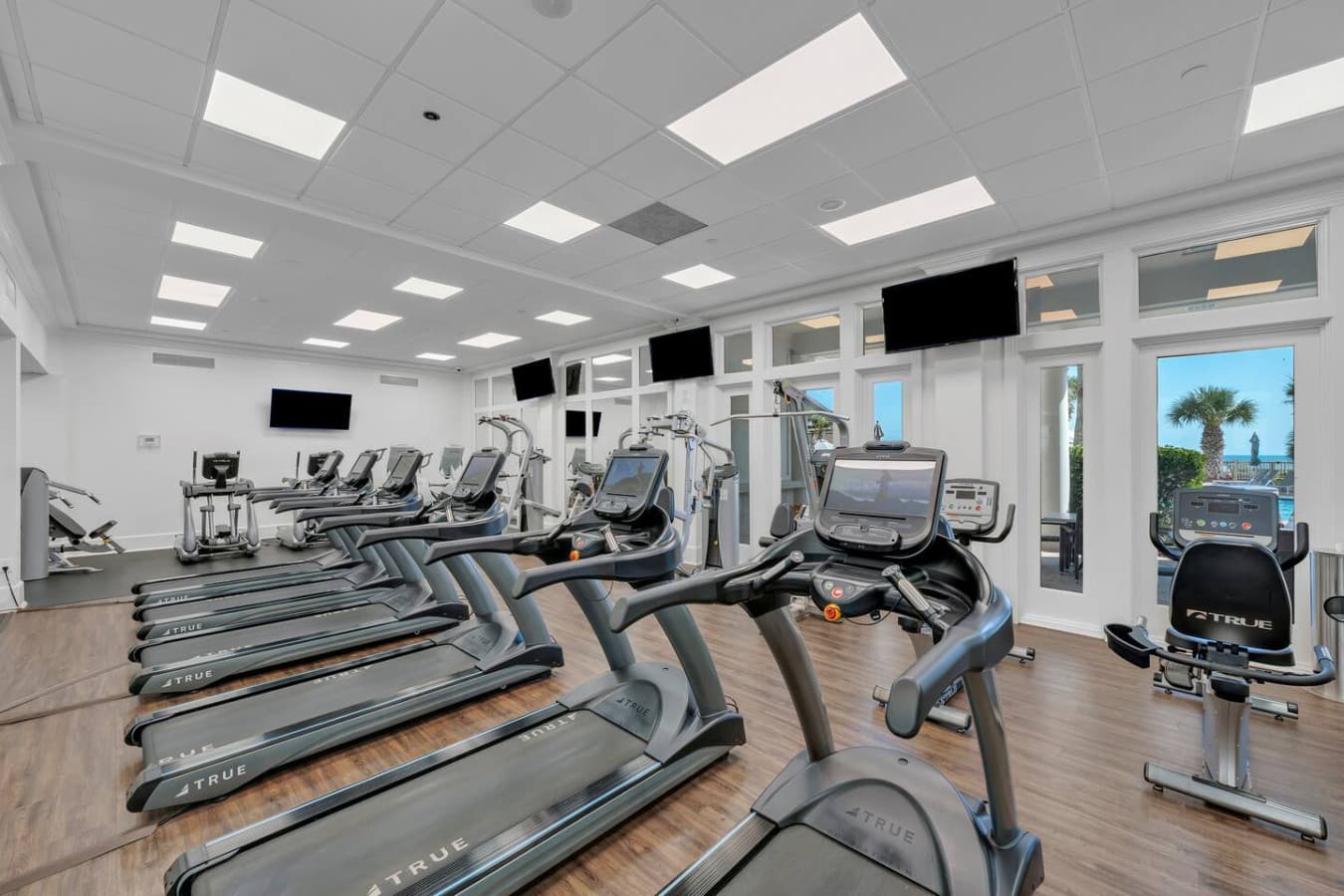 On site fitness center with a variety of workout equipment.