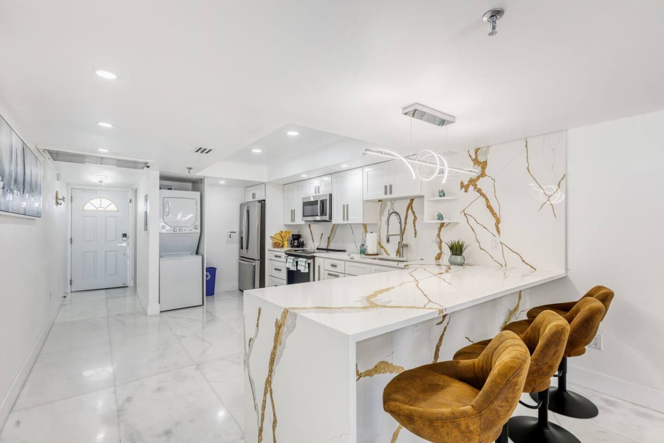 Spacious open layout connecting kitchen and dining areas.
