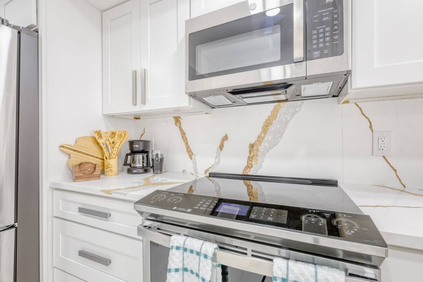 Convenient coffee station with microwave and stove setup.