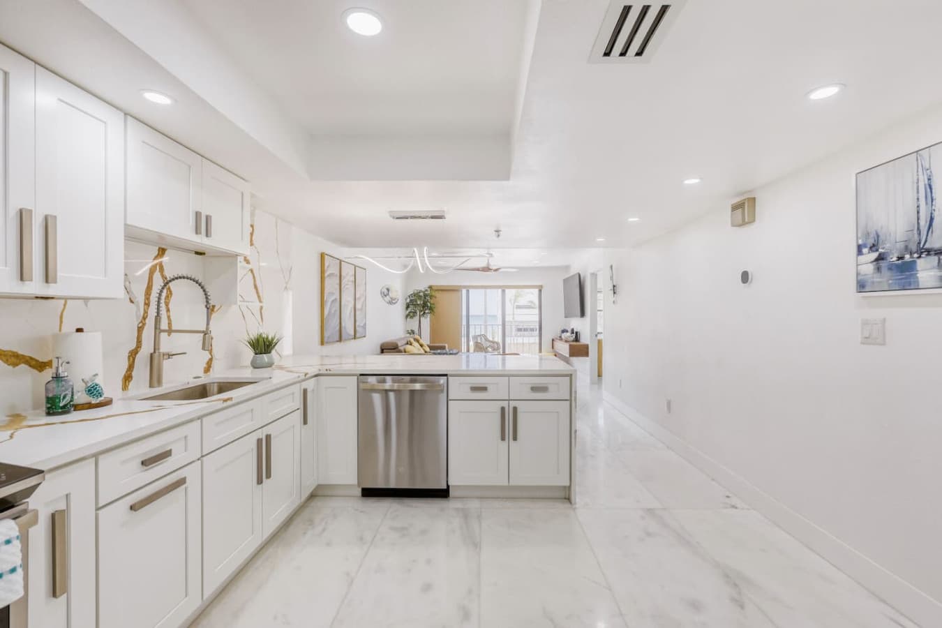 Extended kitchen space with generous storage and prep area.