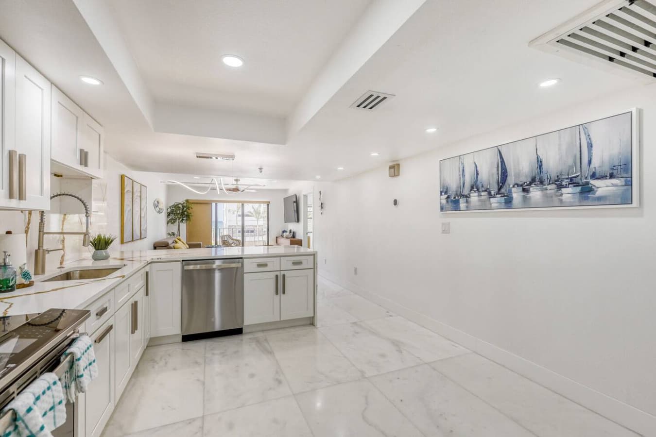 Open concept kitchen with bright modern finishes and spacious layout.