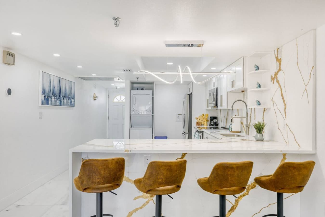 Stylish breakfast bar with comfortable seating and statement lighting.