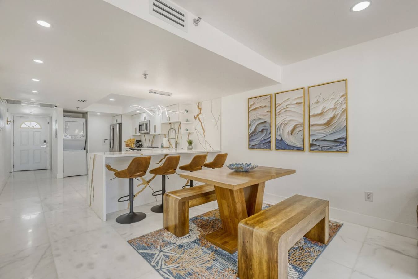 Dining area with solid wood table and bench seating.