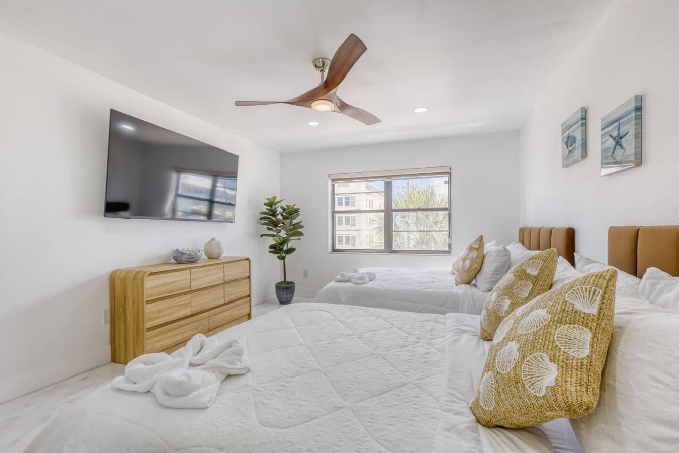 Primary bedroom with tv and relaxing atmosphere.