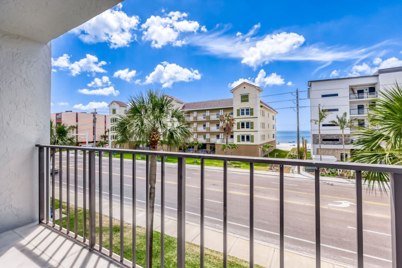 Private balcony with partial water and neighborhood views.