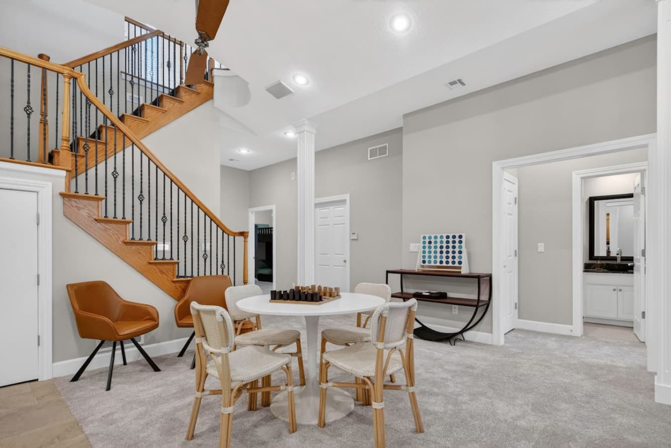 Bright gathering space with vaulted ceilings and plenty of room for family meals or game nights.