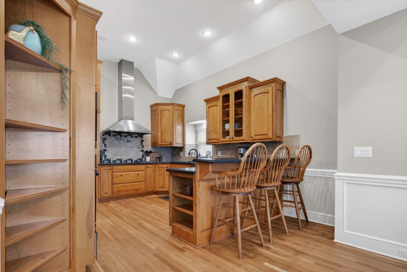 Open kitchen layout with bar seating perfect for casual meals and entertaining.