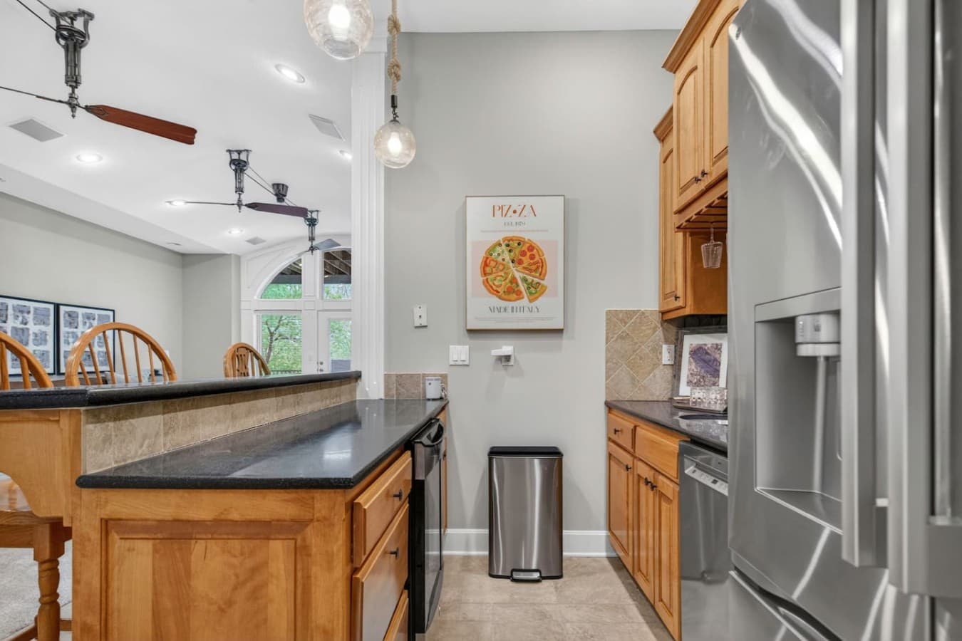 Convenient secondary prep area with additional counter space and easy access to the main living areas.